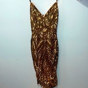 Kaylee kollection- black dress w/nude lining and gold sequence. Size S